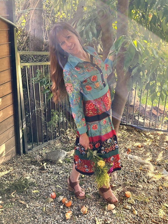Heather Logghe, MD, standing in a garden